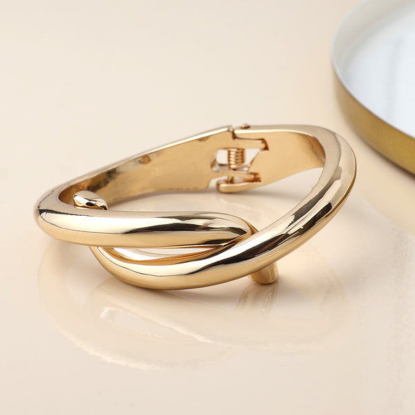 Peace of Mind Golden Crossover Hinged Bangle