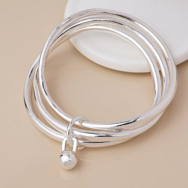 Peace of Mind Silver plated bangle stack with ball charm