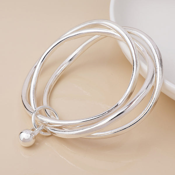Peace of Mind Silver plated bangle stack with ball charm