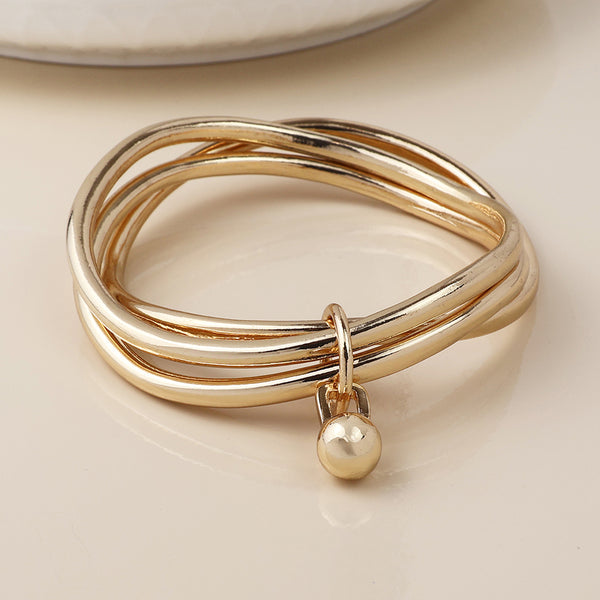 Peace of Mind Golden bangle stack with ball charm