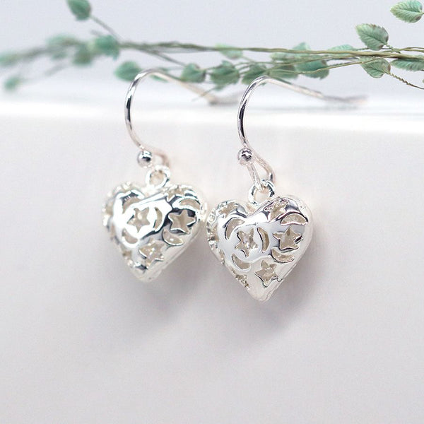 Peace of Mind Silver plated heart drop earrings with cosmic cut-outs